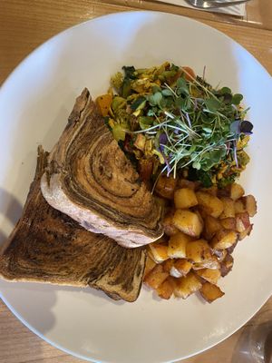 Vegan tofu scramble with marble rye breadd  at Cafe Du Soleil in Vancouver