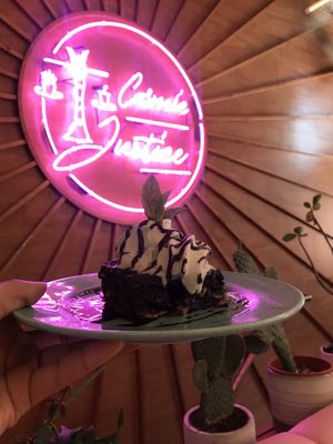 Brownie with coconut ice cream  at Genesis Plant Based Alchemy in North London