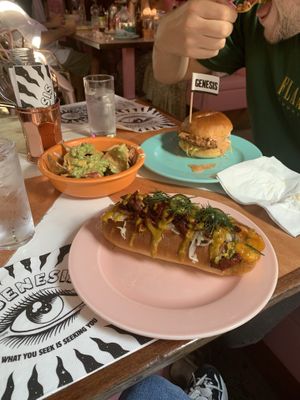 Reuben hot dog, nachos (already started on) & chicken burger!! at Genesis Plant Based Alchemy in North London