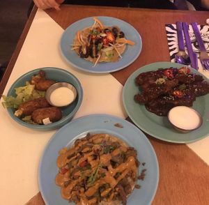Clockwise - hoisin taco, Korean bbq wings, Cajun kebab taco, cheese sticks  at Genesis Plant Based Alchemy in North London
