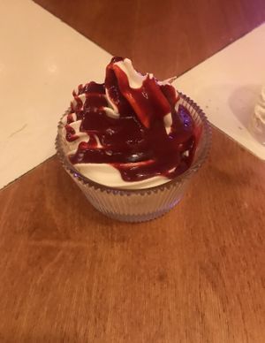 Vegan soft serve with raspberry sauce  at Genesis Plant Based Alchemy in North London