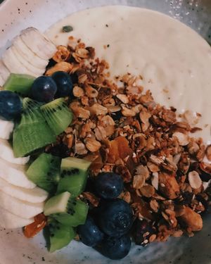 Vegan tropical smoothie bowl with fruits and granola at Stars Coffee in Riga