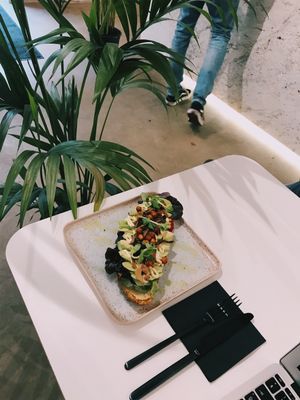 TOP Vegan avocado toast with hummus, vegan mayonnaise, salads and turkish peas and green oil. at Stars Coffee in Riga