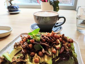 Avocado toast w/ roasted mushrooms + chickpeas and vegan mayo at Stars Coffee in Riga