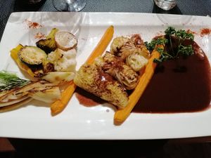 Main dish with super interesting combination of cabbage roles and a chocolate, red wine sauce at Au Goût du Jour in Eupen