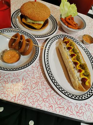 Vegan hot dog, cheeseburger, onion rings and sweet potato fries with vegan dressing at American Dream Diner in Geneva