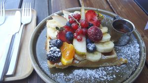 Vegan waffle with fruit and syrup. at Cafe Nomad - Weststadt in Heidelberg