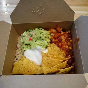 Bean chilli with brown rice, tortillas, guacamole and oat creme fraiche at Good To Go - The Bower in London