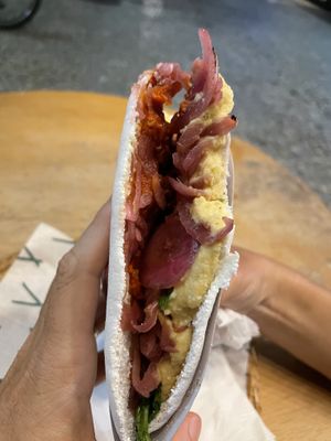 New flavor. Hummus, red onions, sundried tomatoes and rúcula .  at Tapi Tapioca - Loja Leblon in Rio De Janeiro