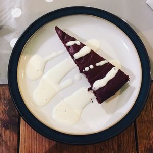 Vegan chocolate orange cake with soya cream   at Pepino Deli in Glossop