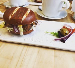 Tofu “chicken” burger on a pretzel bun  at Pepino Deli in Glossop