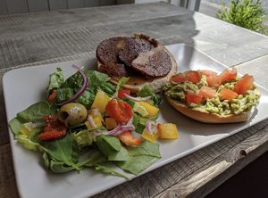 Seitan bacon and crushed avocado bagel at Pepino Deli in Glossop