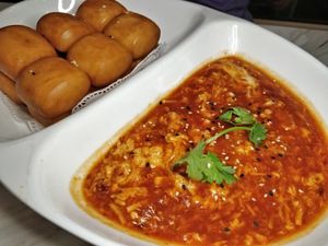Chilli crab sauce with 12 pcs of buns at Mother Earth 大地之素 in West Singapore