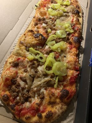 Trad pizza - red sauce, vegan cheese, beyond sausage and banana peppers   at &pizza in Mclean