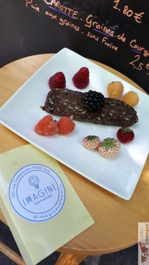 Fruits (raspberry, strawberry, blackberries) and raw banana bread ! at Imagine Café in Paris