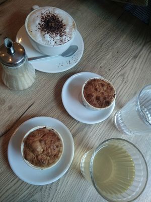 Financiers,  kéfir de figue, cappuccino. at Be Kind Cafe in Geneva