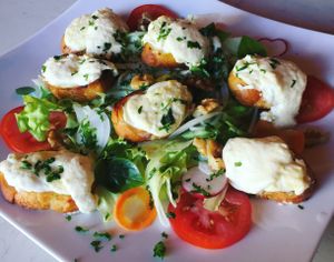 (Vegetarian) Melted goat cheese on toasted French baguette bread with Fresh salad  at Backstage Bar & Grill  in Phan Thiet