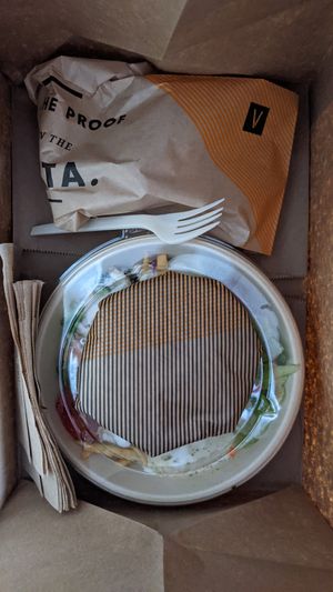 Home delivered bowl with pita at CAVA - Congress Ave in Austin