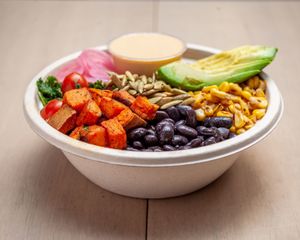 black beans, sweet corn, sweet potato, kale, avocado, pickled onion and pumpkin seeds. And a base made from whole rice.  With cashew spicy dressing  at Mora Mora - Polanco in Mexico City