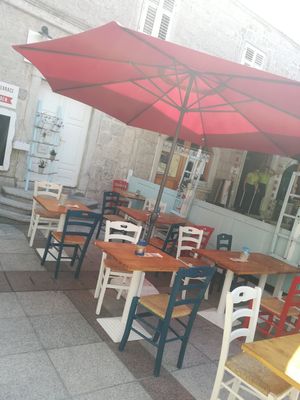 Cozy seating spot on the main plaza at Konoba Andreja in Krk