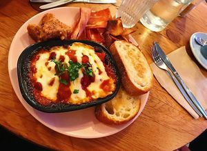 Homemade baked beans with cheese, sourdough toast, bacon and a couple of pieces of their KFC on the side at Good Love in St Kilda