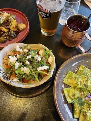 Selection of goods. Vegan feta on the tomato and sourdough salad at The Juniper Bistro in Banff