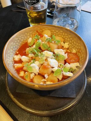 Blistered tomato potato dumplings with vegan feta at The Juniper Bistro in Banff