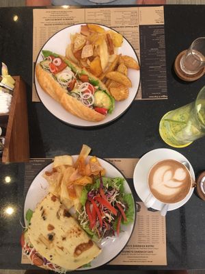 Mediterranean Veggie Vietnamese Baguette & Olive Flatbread, Almond Cappuccino at Journeys Sandwich Cafe in Ho Chi Minh City