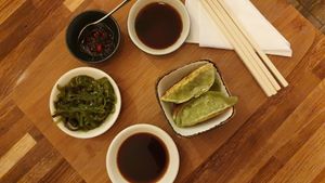 Grilled gyoza, algae salad and sauces at Chez Ann in Paris