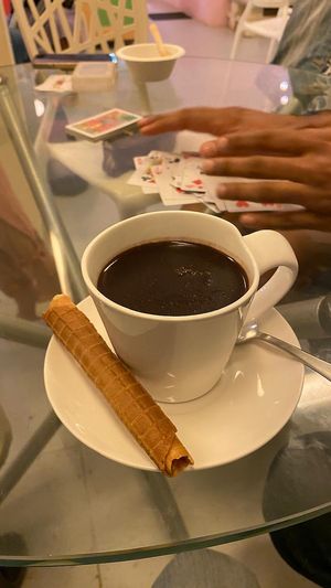 Vegan hot chocolate ☕️ and a game of cards, poi-poi    at Gelato Factory in Auroville