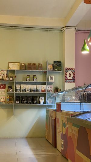 Tea shelf and packed ice cream freezers with half being vegan. (Still hoping for 100% Ⓥ in the future.)  at Gelato Factory in Auroville
