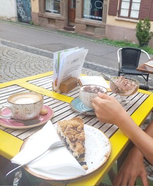 Oat milk cappuccino, "Kinduccino"(kids cappuccino), ice cream and blueberry poppy crumble cake at Brettle in Ulm