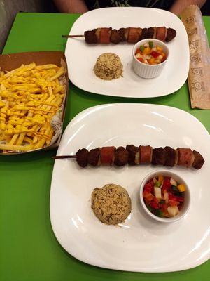 Espetinhos e batata frita com cheddar at Açougue Vegano - Ipanema in Rio De Janeiro