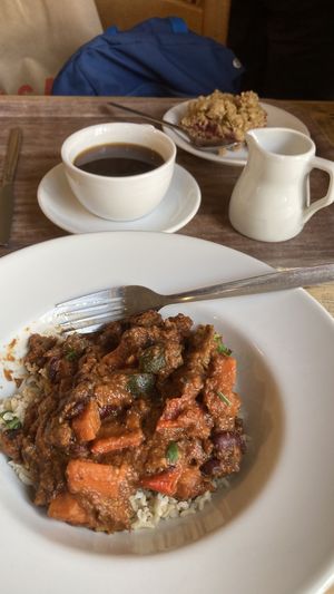 Chickpea and rice curry. Oat fruity bar and coffee with oat milk. Lovely.   at The Good Earth in Wells