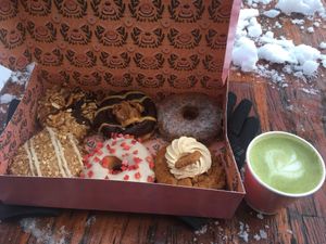 Weekend Special at the bottom left: Donut filled with apple compote, topped with oats. Other specials: Salzed Pretzel and biscuit donut  at Brammibal's Donuts - Potsdamer Platz in Berlin