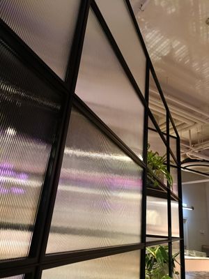 Interior facing seating area across from counter at Brammibal's Donuts - Potsdamer Platz in Berlin