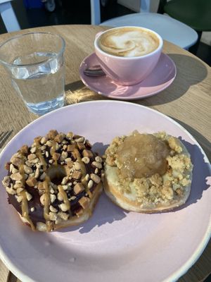 Caramel chocolate crunch and apple pie donuts, Oatly americano  at Brammibal's Donuts - Potsdamer Platz in Berlin