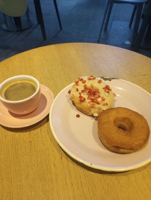 White choc and strawberry, cinnamon sugar donuts. Americano coffee, small. at Brammibal's Donuts - Potsdamer Platz in Berlin
