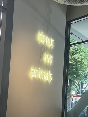 “Donut eat animals” quote on wall at Brammibal's Donuts - Potsdamer Platz in Berlin