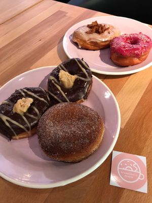 2 chocolate peanut butter, espresso, hibiscus and maple coconut bacon!!! at Brammibal's Donuts - Potsdamer Platz in Berlin