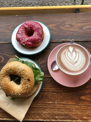 Hummus and pesto bagel, hibiscus donut and hot chocolate  at Brammibal's Donuts - Potsdamer Platz in Berlin