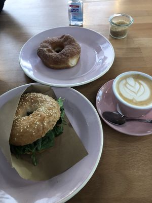Bagel sandwich, cinnamon sugar donut and of course, cappuccino! at Brammibal's Donuts - Potsdamer Platz in Berlin