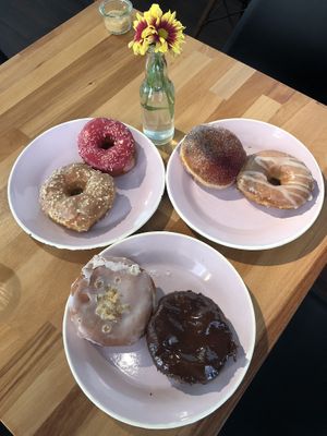 Boston cream, earl grey lemon, hibiscus, salted caramel, gin and vodka, strawberry jam! at Brammibal's Donuts - Potsdamer Platz in Berlin