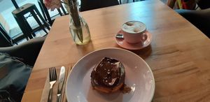 Boston cream donut and cappuccino at Brammibal's Donuts - Potsdamer Platz in Berlin