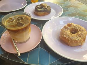 Iced latte, salted caramel hazelnut donut and chocolate and peanut butter donut at Brammibal's Donuts - Potsdamer Platz in Berlin