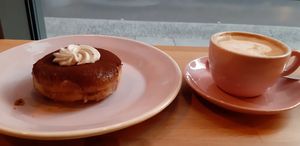 Tiramisu donut and cappuccino at Brammibal's Donuts - Potsdamer Platz in Berlin