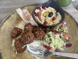 Fresh baked sourdough bread. Falafel plate with hummus and two salads   at Twenty4 in Siquijor