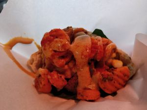 Half falafel sandwich with jalapeno, special carrot and corn/coconut extra topping+spicy tahini dressing at Falafel Brothers - Ebisu in Tokyo