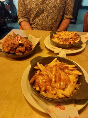 Wings, teddy bear fries and cheese and gravy fries. at Tiny Rebel in Cardiff
