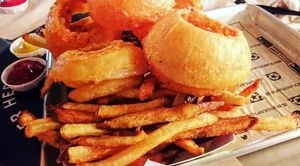 Fries and onion rings at BurgerFi in Wellington
